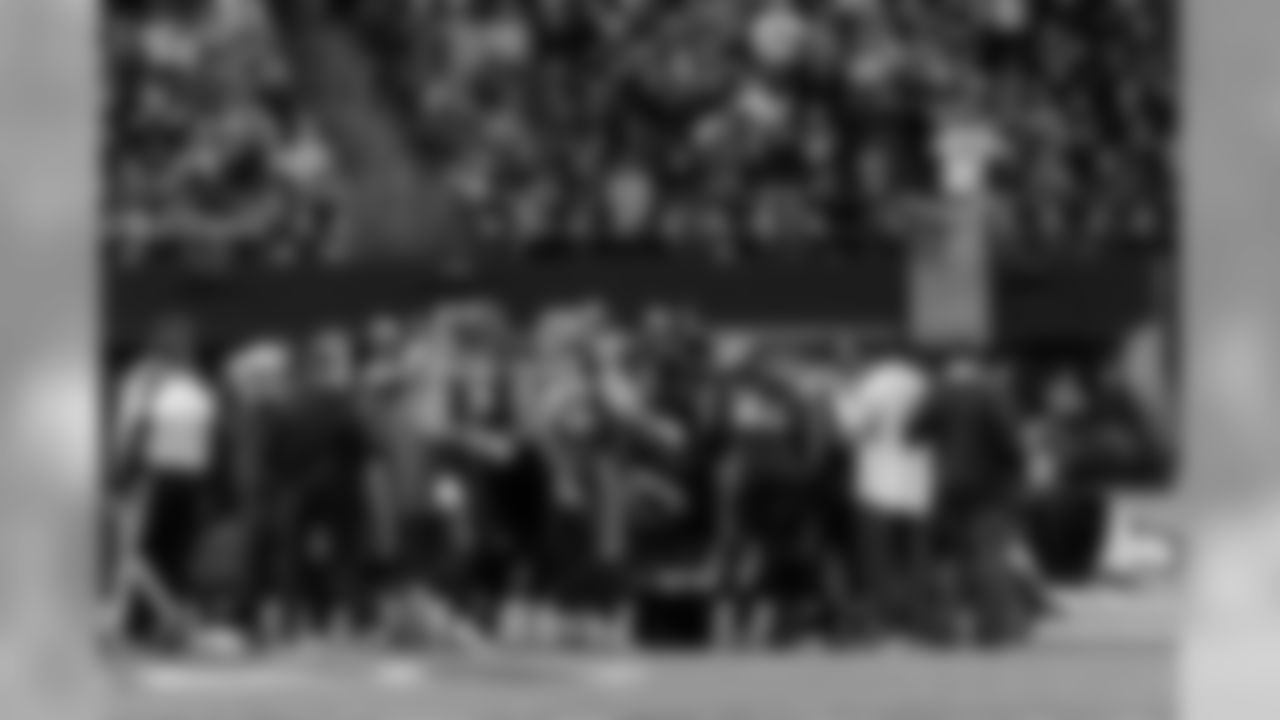 The Seahawks entire team walked onto the field and surrounded injured running back Chris Carson, who was taken off the field on a cart.