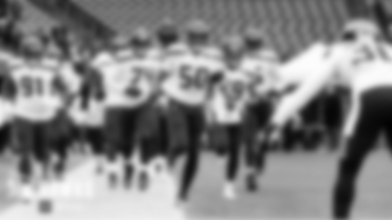 Seahawks players take to the field for pregame warmups led by K.J. Wright.
