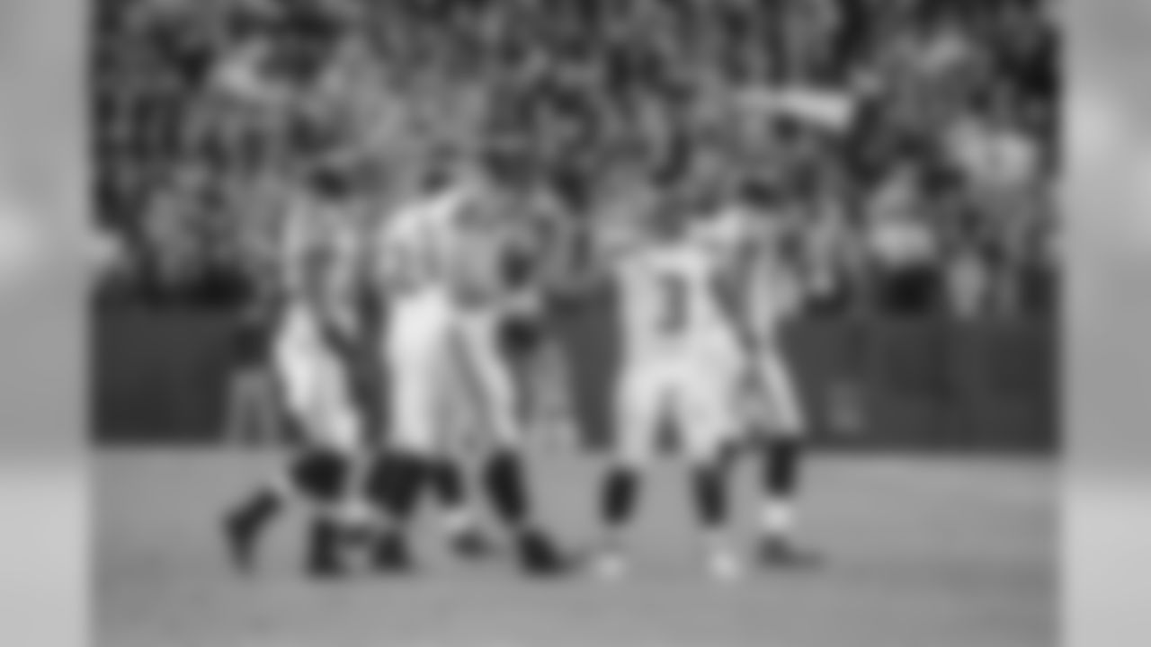 Quarterback Russell Wilson heads for the sidelines with his offensive teammates after the Seahawks final offensive drive ended up with a turnover.