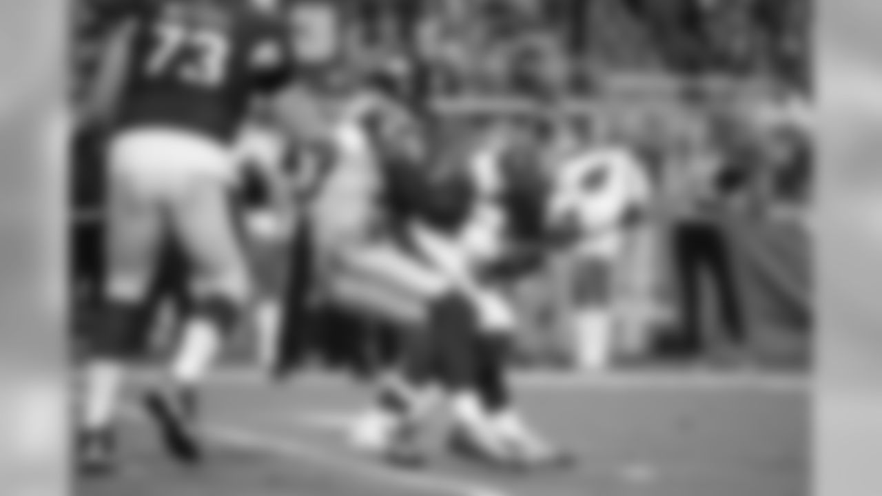 Defensive end Jacob Martin tackle's Arizona's David Johnson for a loss.