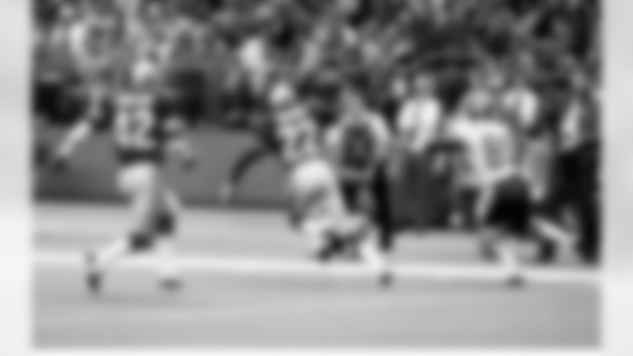 Seattle Seahawks defensive back Dave Brown steps in front of Kansas City wide receiver Henry Marshall in route to his second interception return for a touchdown as the Seahawks shutout the Kansas City Chiefs 45-0, November 4, 1984. Brown combined with Keith Simpson and Kenny Easley to establish the NFL record for most interception returns for touchdowns at four. The three also combined with defensive back Terry Taylor, who intercepted two Chiefs passes that afternoon, to establish a new NFL mark for most interception return yardage in one game with 345 return yards (Brown 148 yards, Simpson 76, Easley 58, Taylor 43) Both records still stand going into the 2020 NFL season.