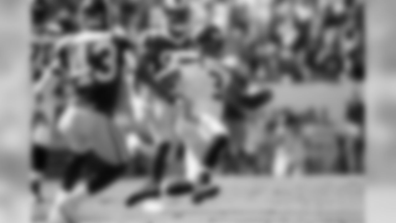 Seattle quarterback Russell Wilson slides after scrambling during the first quarter.