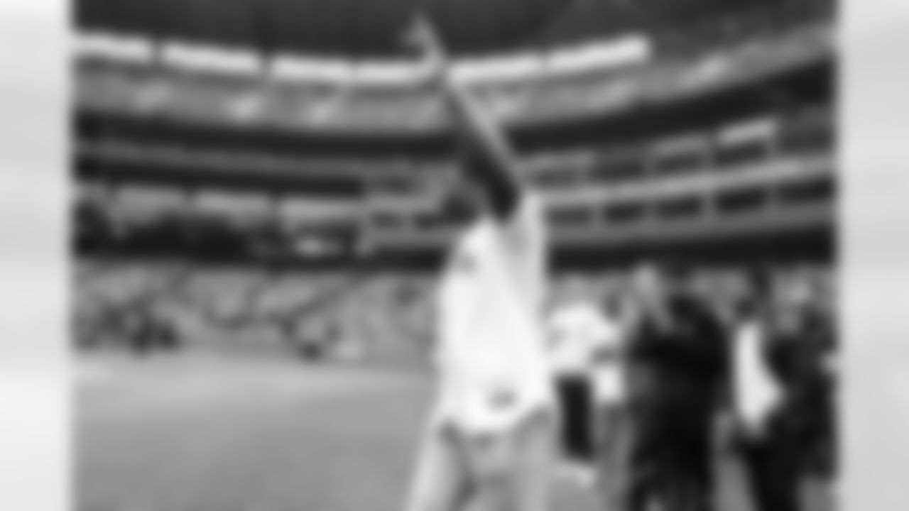 Seahawks first round pick Charles Cross throws out the ceremonial first pitch for the Seattle Mariners at T-Mobile Park on May 29, 2022.