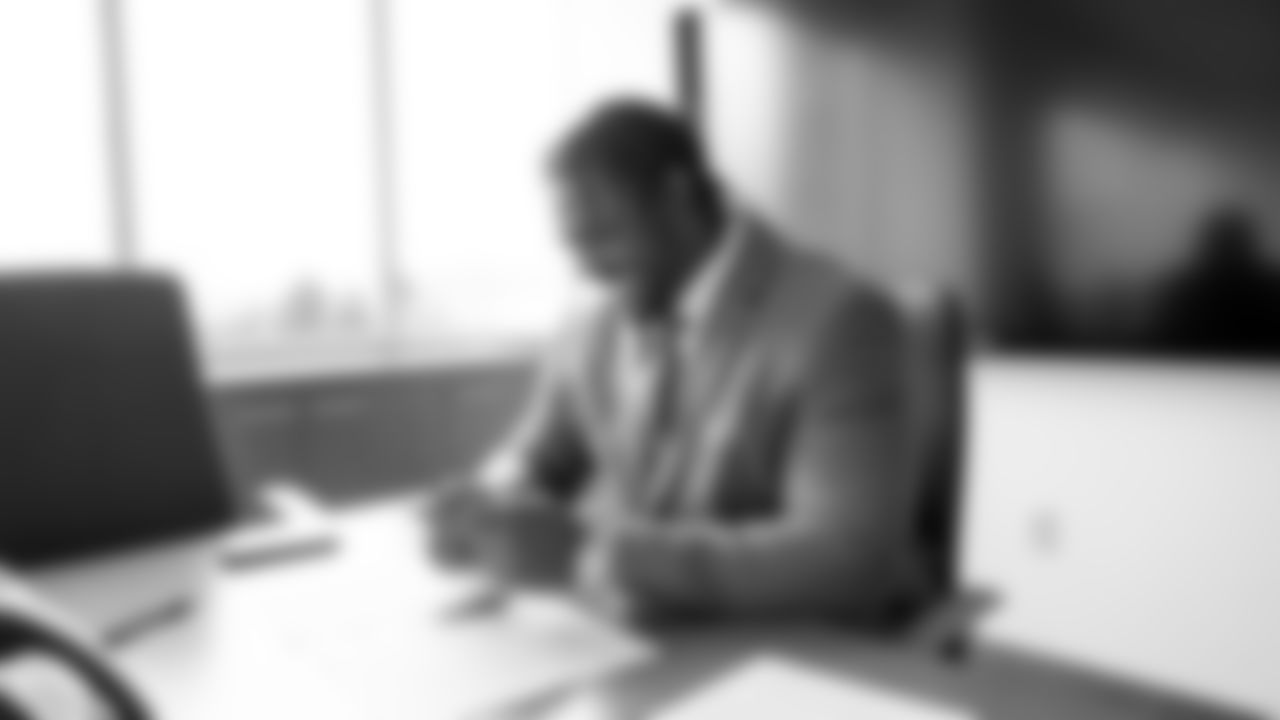 Seahawks guard Phil Haynes signs a contract extension with the team at the Virginia Mason Athletic Center in Renton, Wash. on February 21, 2023.
