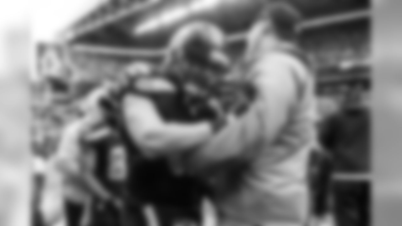 Tight end Luke Willson is congratulated on the Seattle sidelines after his two-point conversion in the final minutes of regulation.
