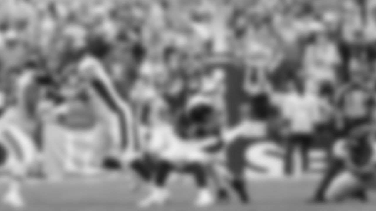 Seattle linebacker Cody Barton sacks Russell Wilson.