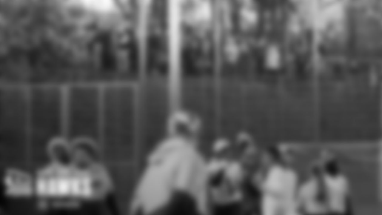 After arriving at the team hotel, the Seahawks departed for a brief practice, which was witnessed by fans lining a fence above the field.