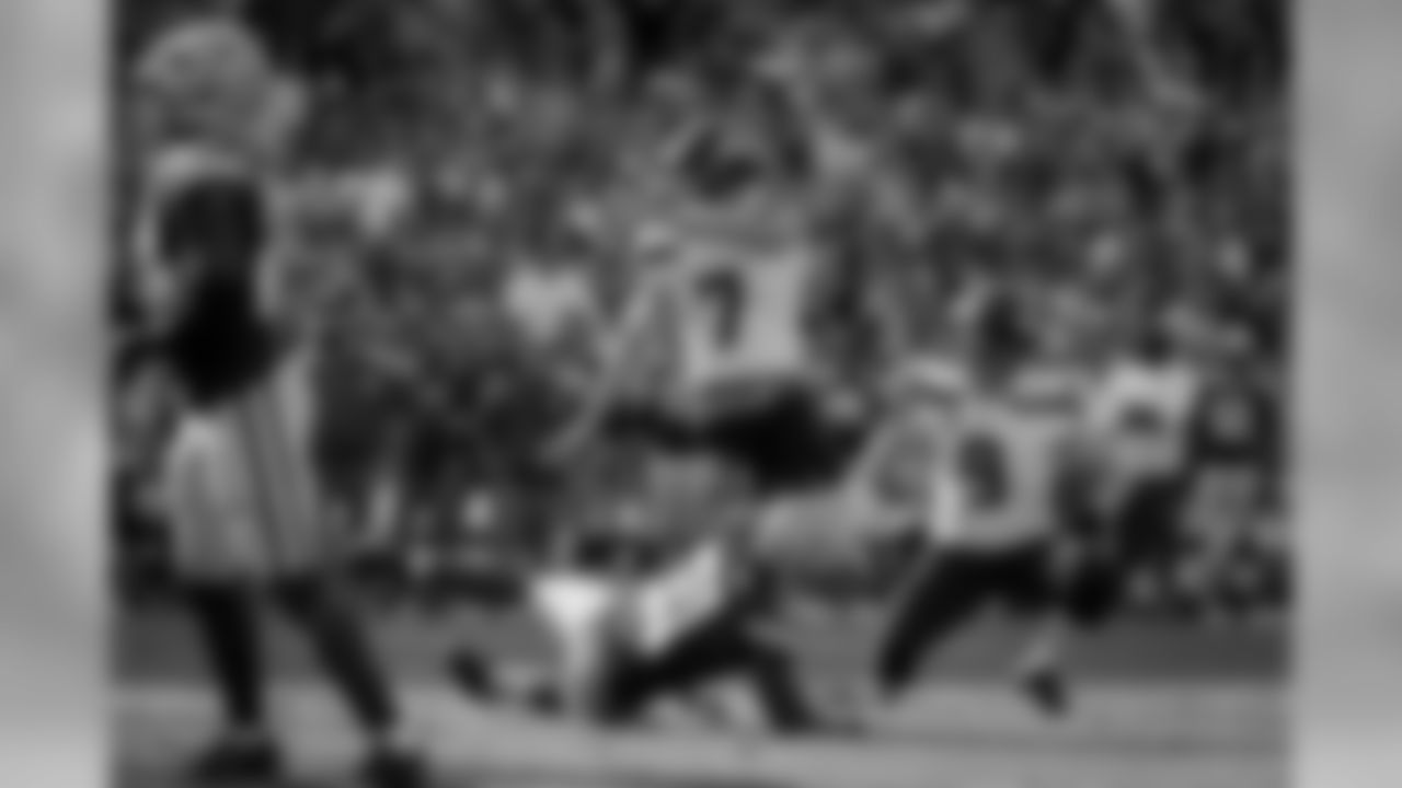 Seattle placekicker Blair Walsh makes the first of this three field goals and is run into by a Packers defender.