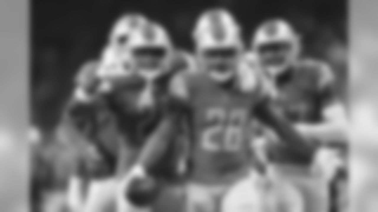 Detroit Lions strong safety Quandre Diggs (28) and teammates face the camera after Diggs' intercepted a pass during the first half of an NFL football game against the Los Angeles Rams, Sunday, Dec. 2, 2018, in Detroit. (AP Photo/Rey Del Rio)
