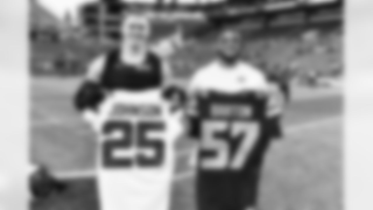 Seattle Seahawks linebacker Cody Barton (57) and New York Jets running back Ty Johnson (25) swap jerseys after an NFL football game on Sunday, January 1, 2023 in Seattle, Washington. (Alika Jenner/NFL)