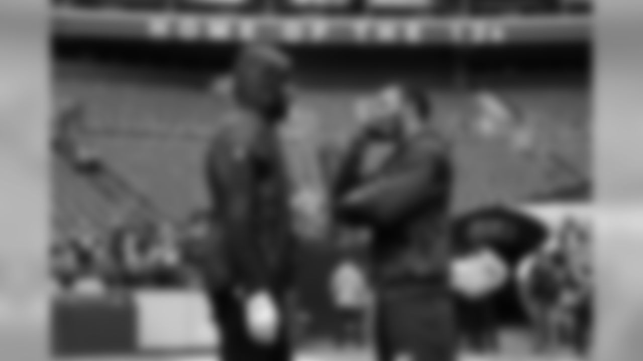 Former teammates and still friends Richard Sherman and Doug Baldwin talk on the field hours before kickoff.