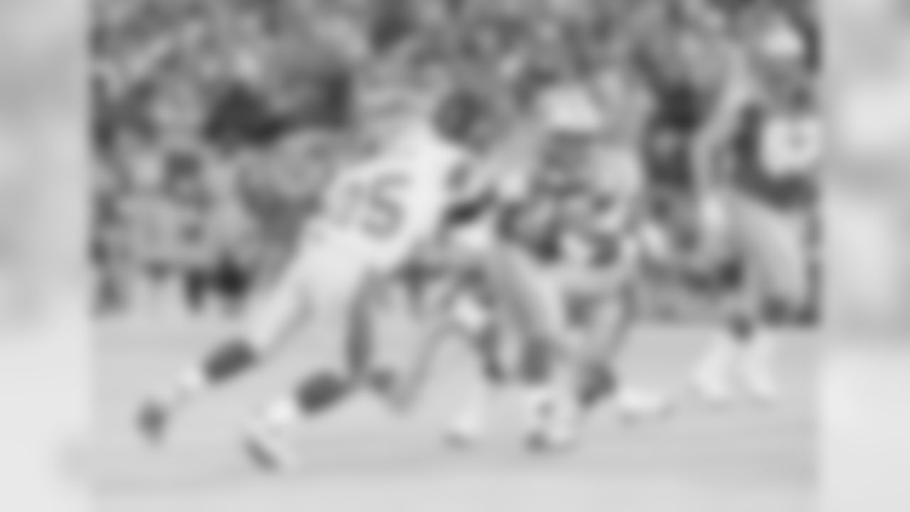 Detroit Lions running back Barry Sanders (20) fights for yardage against Seattle Seahawks' Robert Blackmon (25) during the second quarter at the Silverdome in Pontiac, Mich., Oct. 17, 1993. (AP Photo/Duane Burleson)