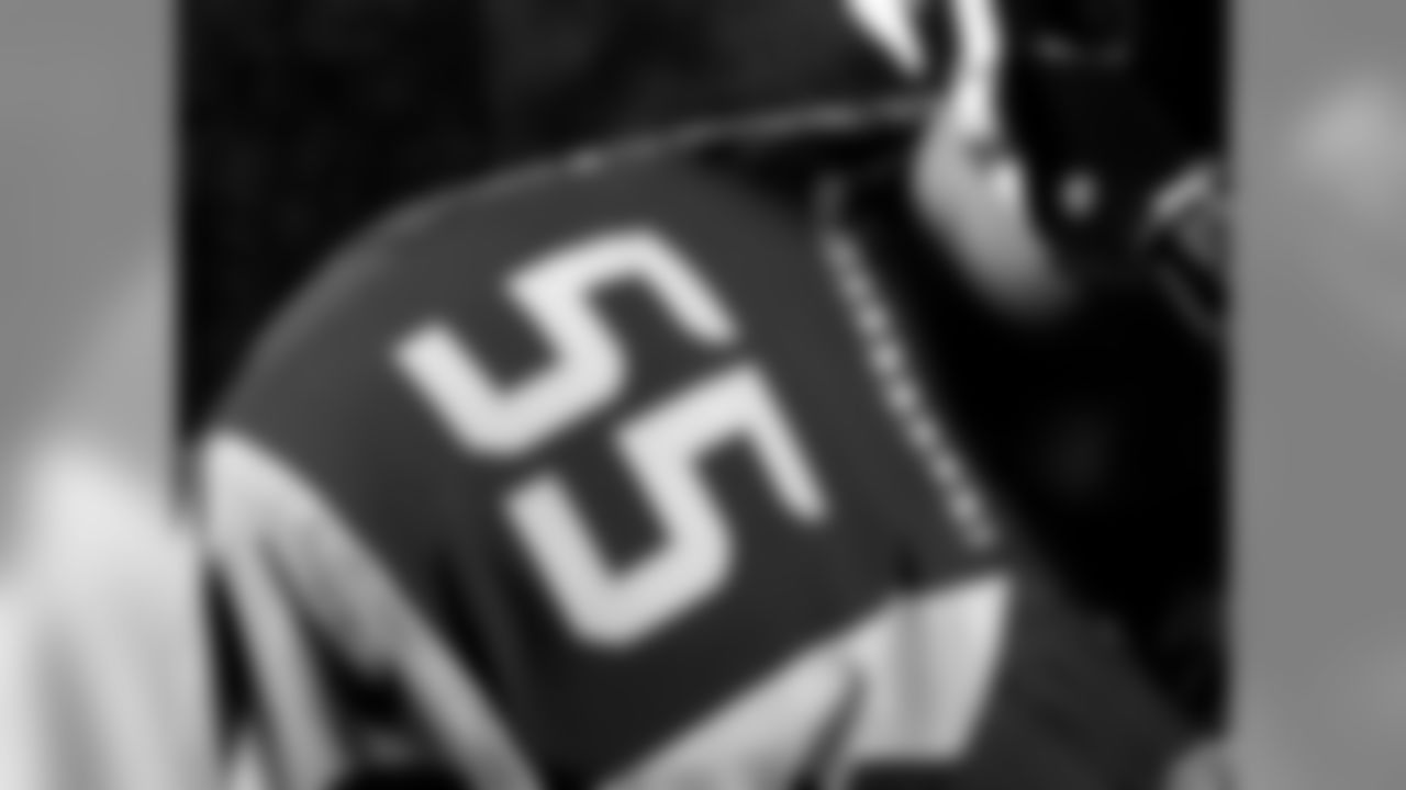 Twelve feathers appear on either side of the jersey collar, honoring the 12th Man.