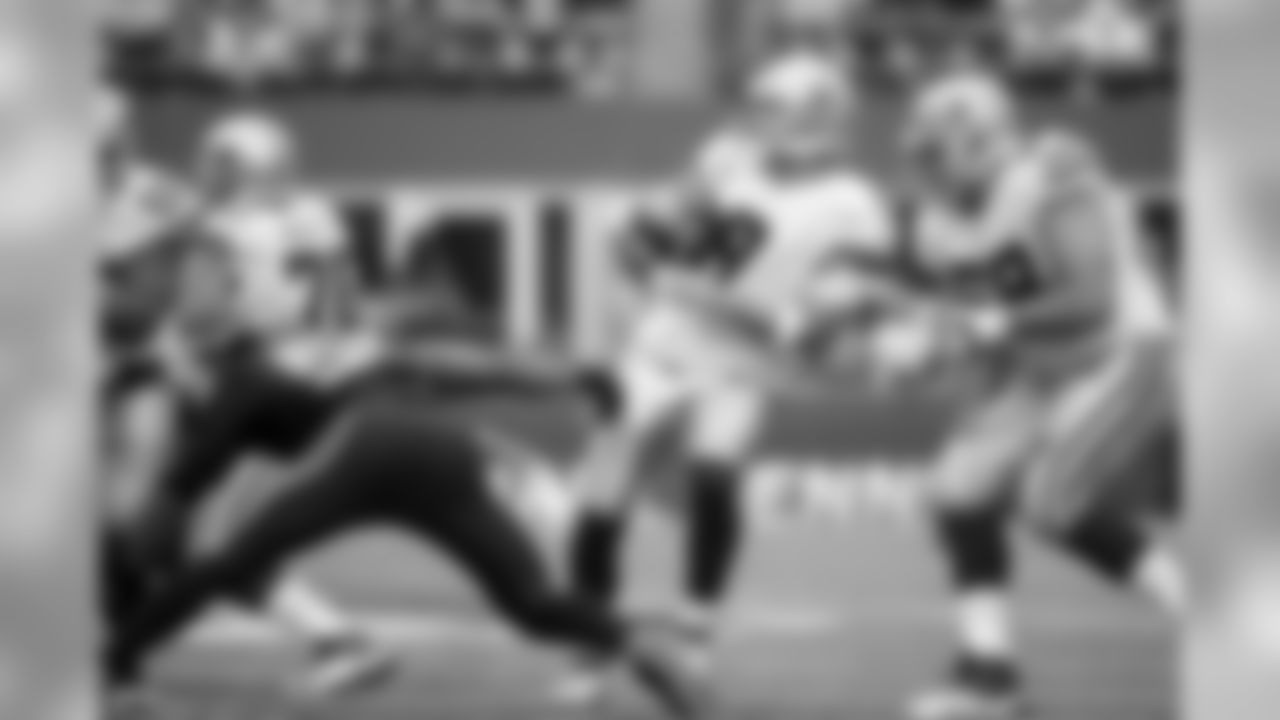 Seattle's pass rush, led by Bruce Irvin on this play, nearly got to Tony Romo who escaped two sacks to extend key drives.