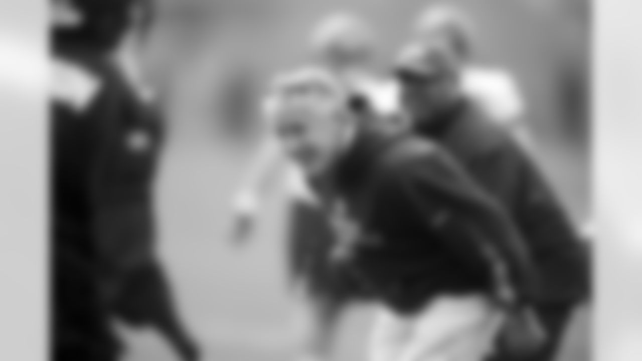 Pete Carroll participates during agility drills