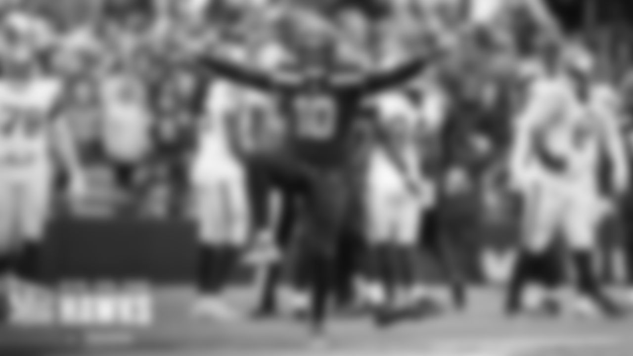 Uchenna Nwosu strikes a pose after a sack in the fourth quarter.