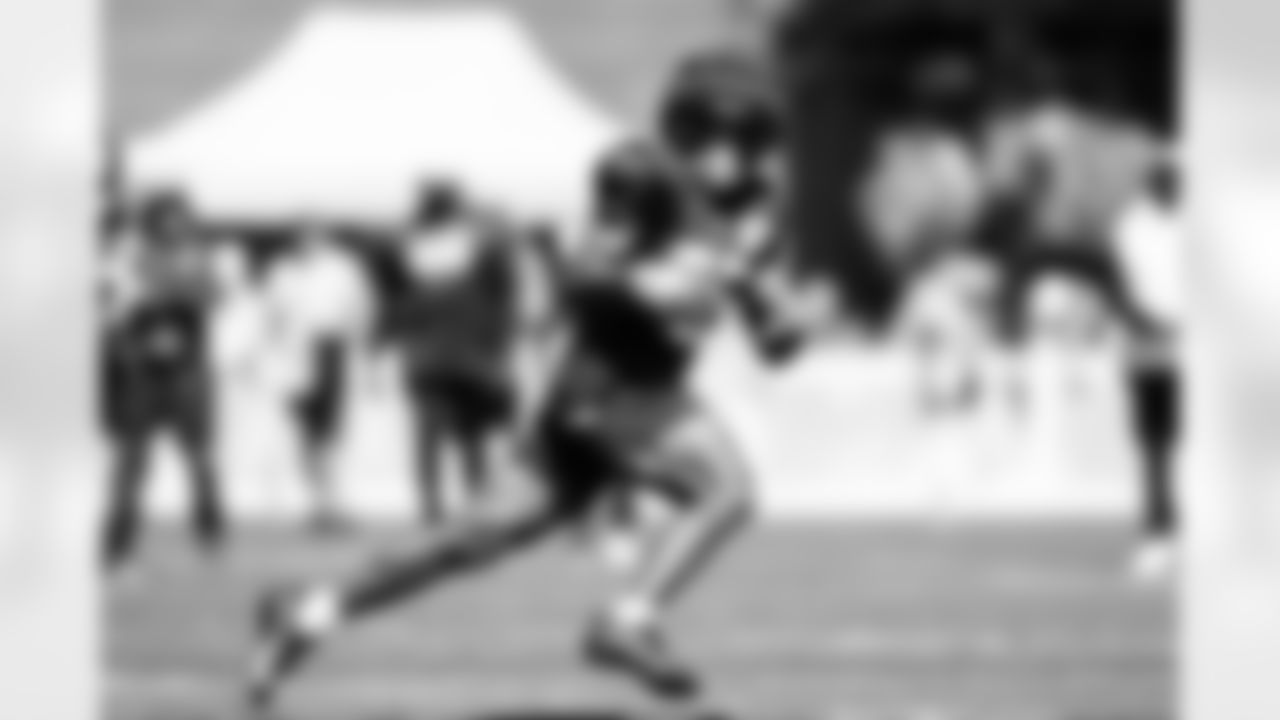 Seahawks running back Kenny McIntosh (25) hit the field for practice on July 31, 2023 at the Virginia Mason Athletic Center in Renton, Wash.