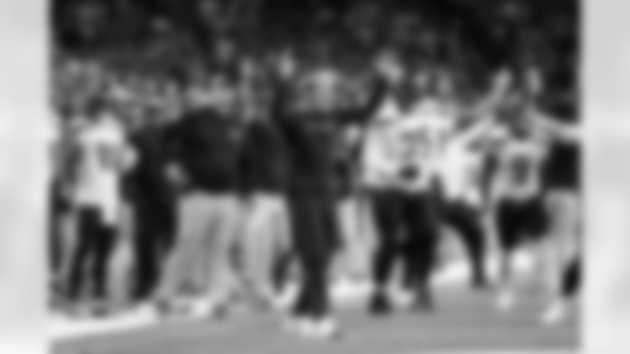 Head coach Pete Carroll and the Seattle sideline reacts as Tyler Lockett scores on a pass reception from Geno Smith in the fourth quarter.