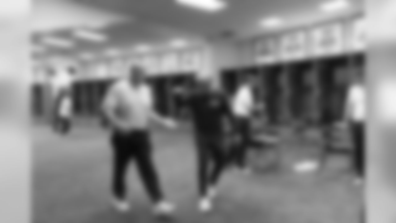 Assistant head coach Tom Cable and head coach Pete Carroll are the last to leave the Seahawks locker room at halftime.