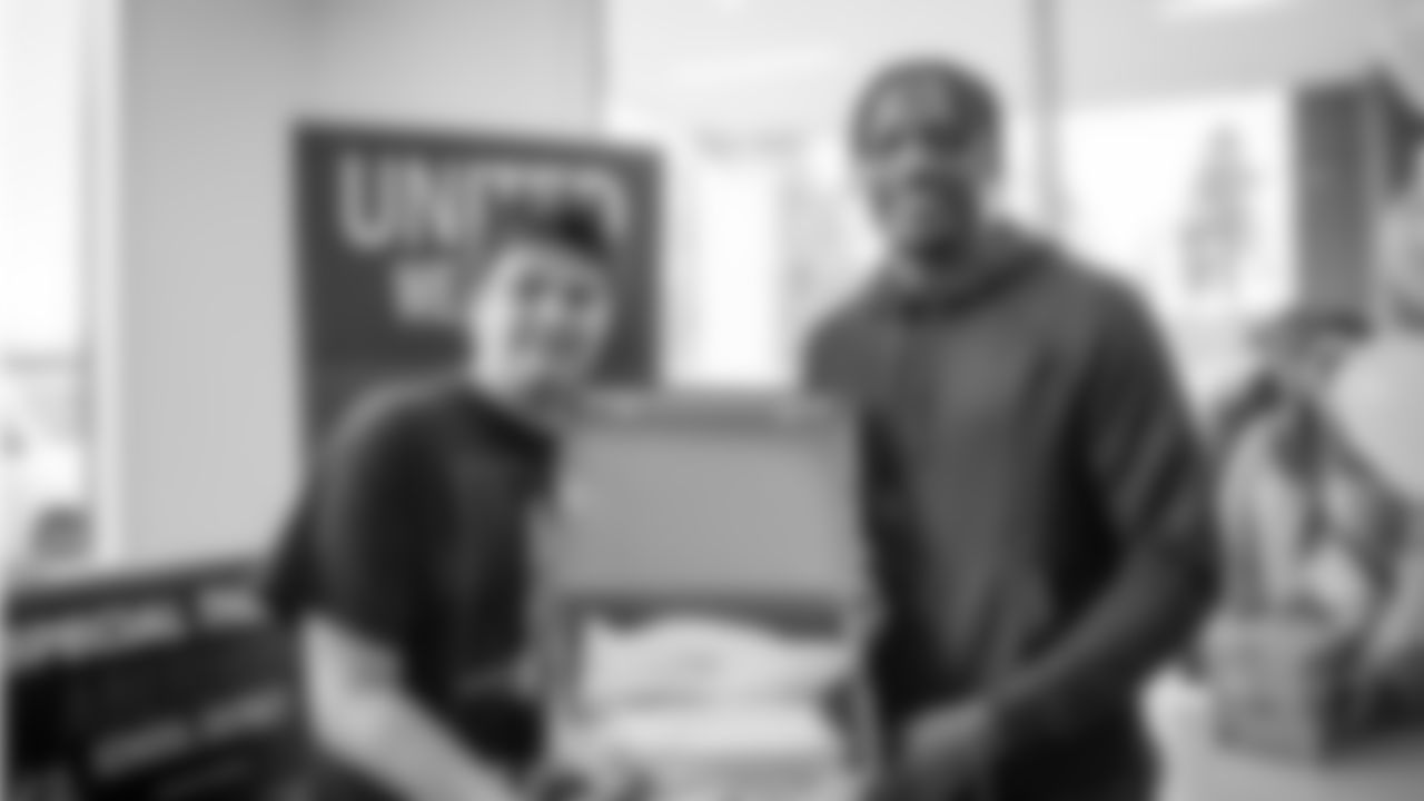 Seattle Seahawks cornerback Tariq Woolen donates sneakers to students in the Grays Harbor area in partnership with United Way of Grays Harbor on April 19, 2023.