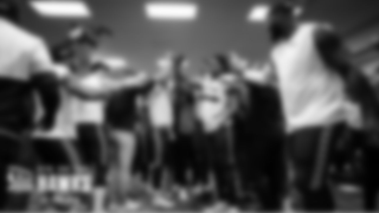 The Seahawks gather in the locker room after the win over the Panthers.