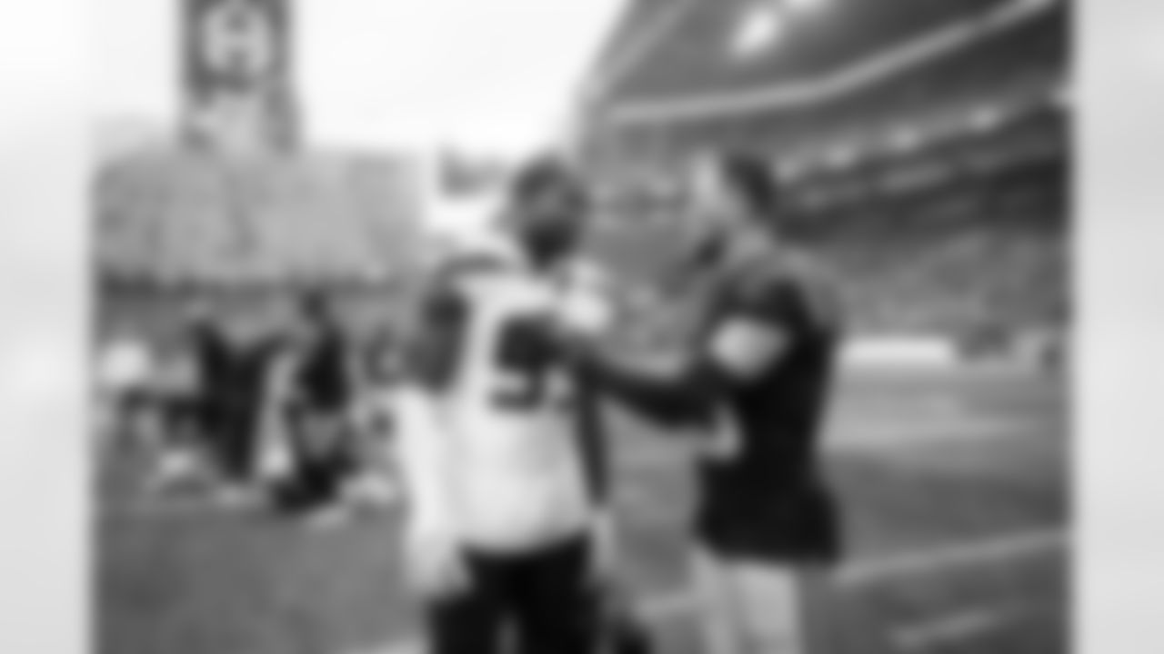 After the game, Boye Mafe of the Seahawks chats with Panthers receiver Adam Thielen.