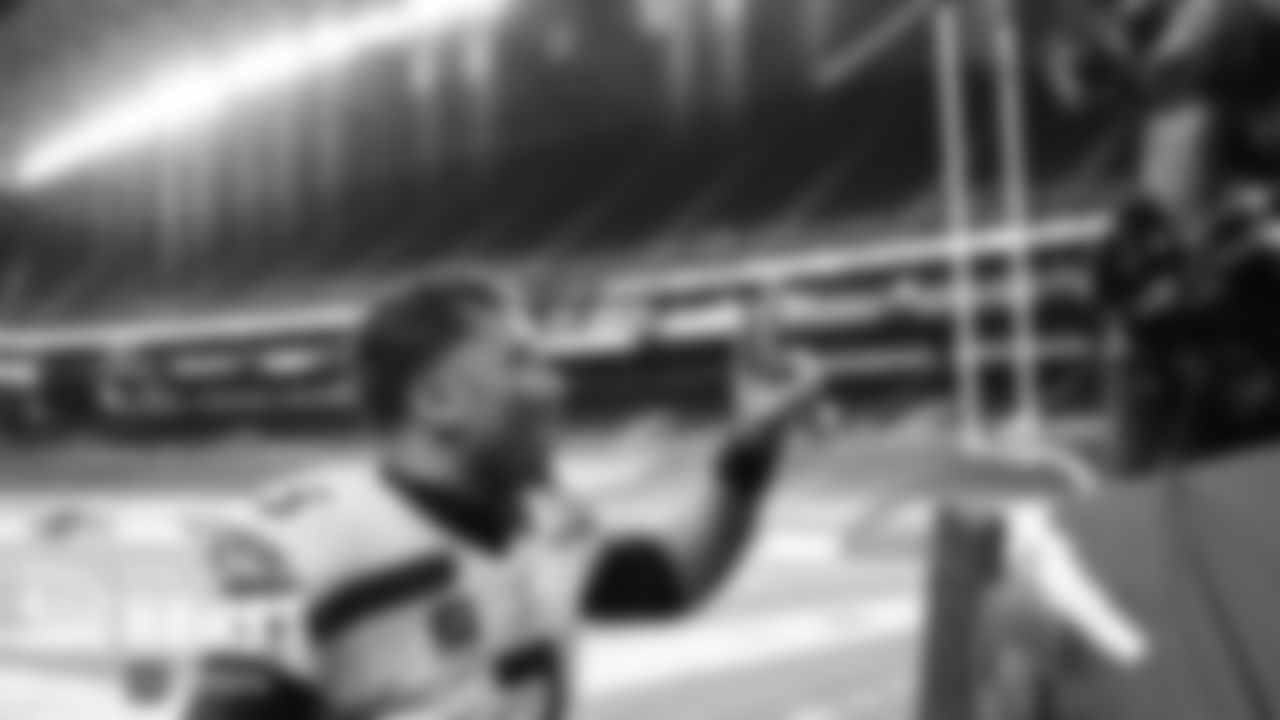 Seahawks quarterback Russell Wilson records a quick video message for fans as he walks off the field after the victory.