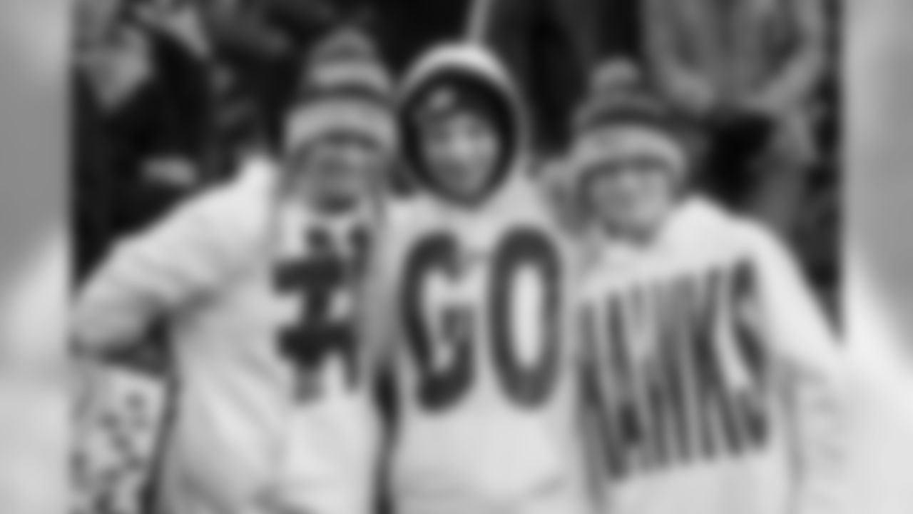 This trio had their hashtag game strong (not to mention bright) as they watched pregame warmups in the south end zone.