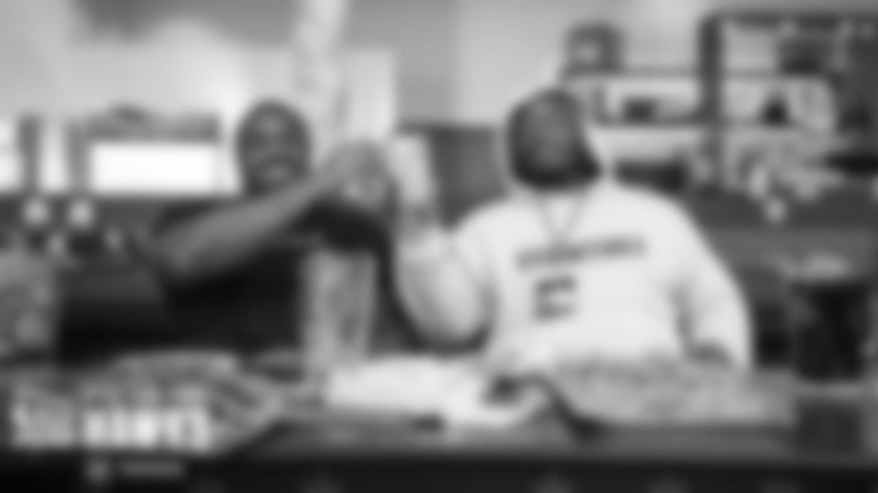 At the team bowling event, offensive linemen Phil Haynes and Damien Lewis share some snacks and soft drinks. And no, those are not individual servings, they just happened to be sitting behind large trays set out for the team.