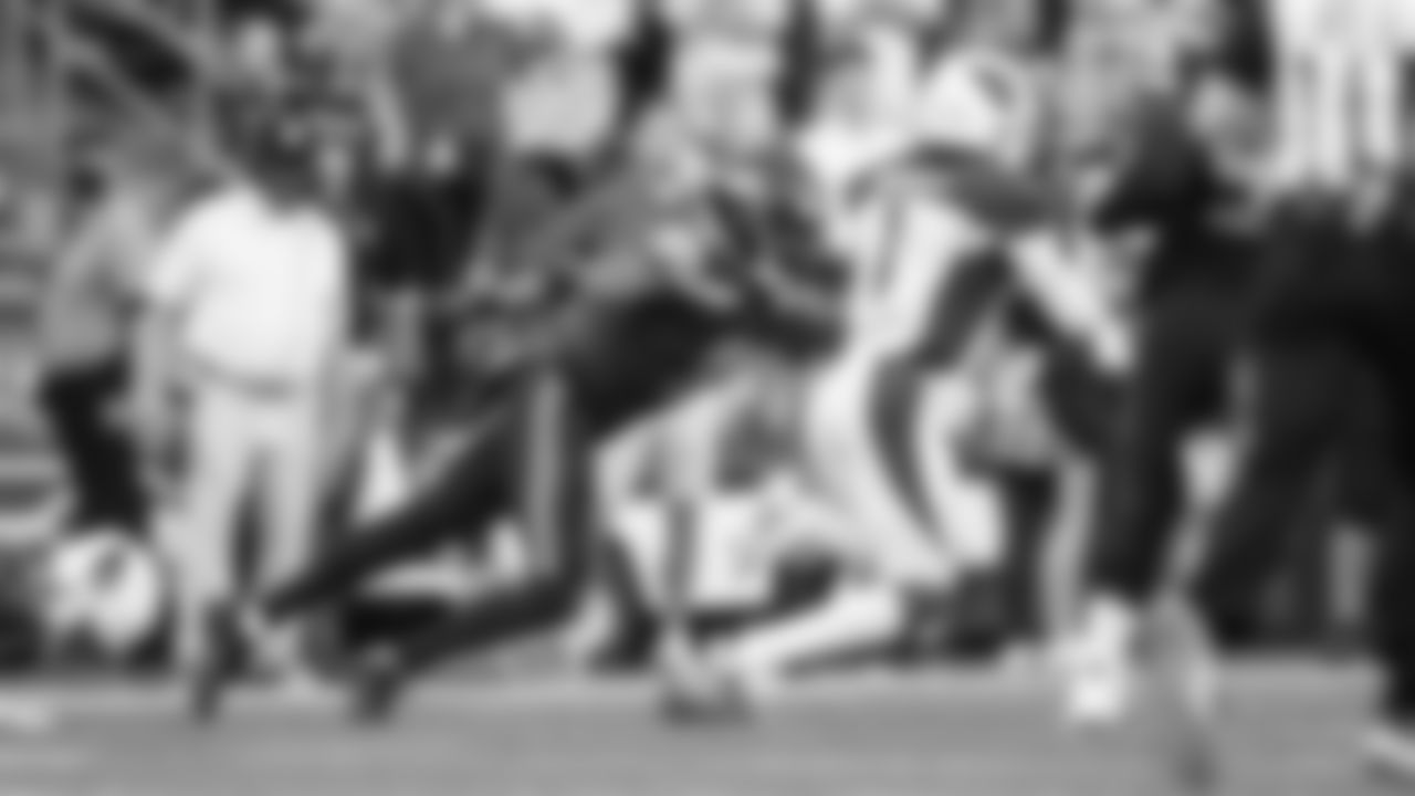 Seahawks cornerback Coby Bryan uses his left hand to punch the ball away from Cardinals quarterback Kyler Murray resulting in a fumble recovered by Seattle's Tariq Woolen.