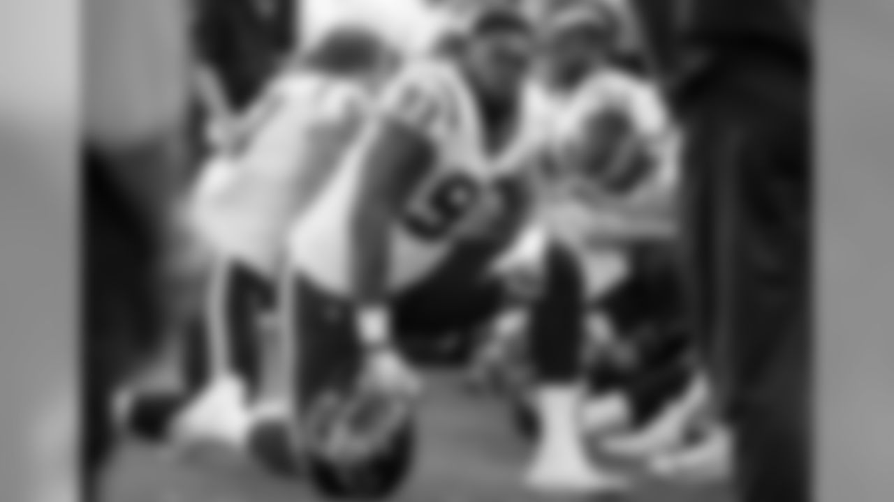 Houston Texans defensive end Joel Heath (93) kneels on the sideline during the second half of an NFL football game against the New England Patriots, Sunday, Sept. 24, 2017, in Foxborough, Mass. (AP Photo/Steven Senne)