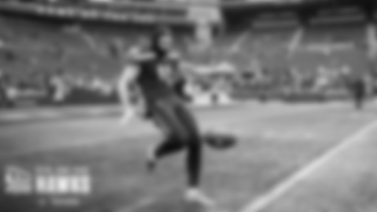 Seahawks punter Michael Dickson takes warmup punts on the field before the game.