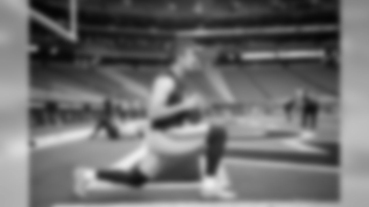 Punter Michael Dickson stretches out before the game.