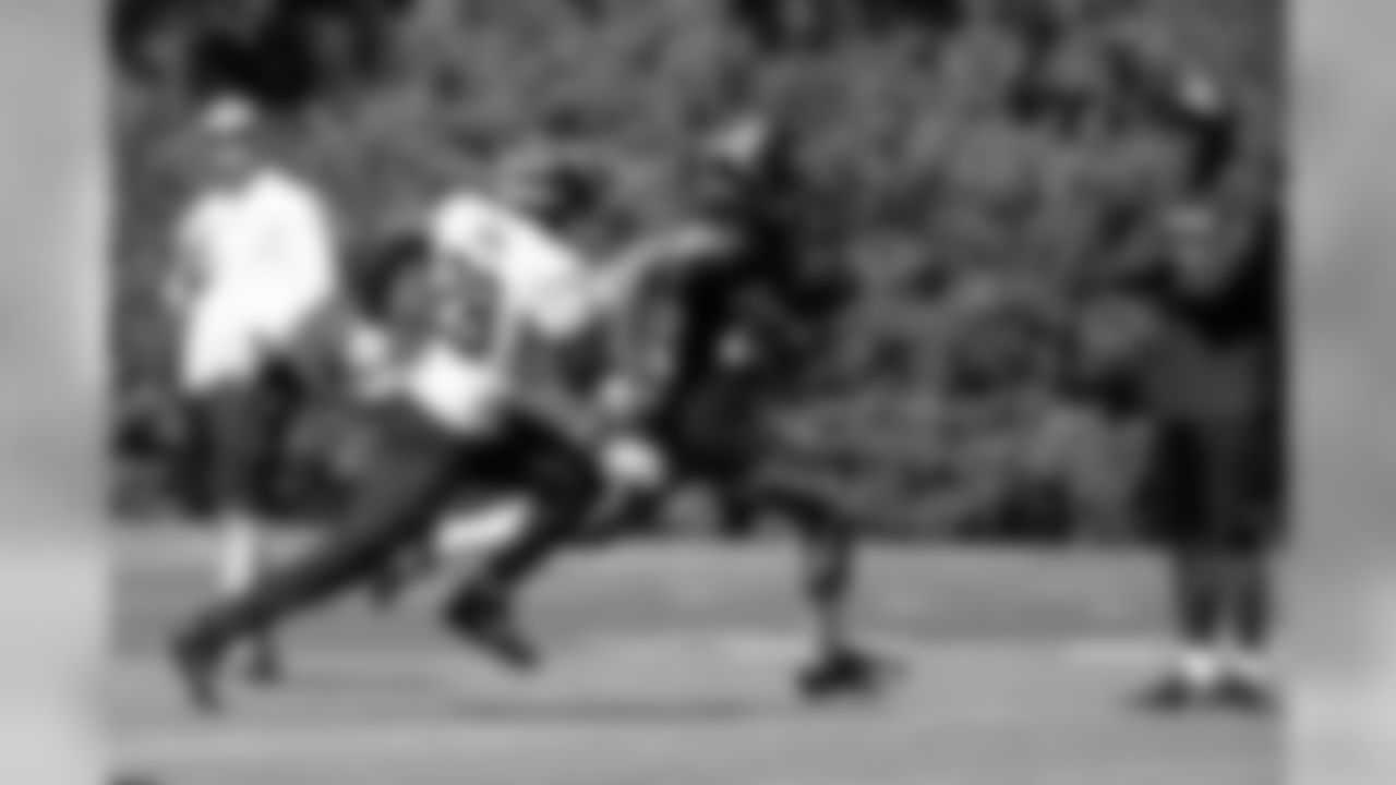 FS Ugo Amadi and RB Travis Homer
