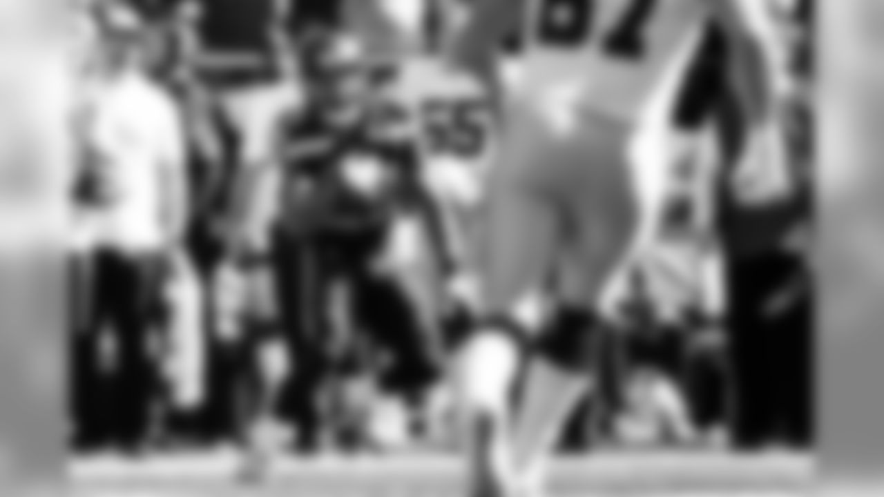 Safety Earl Thomas returns the first of his two interceptions on the day.