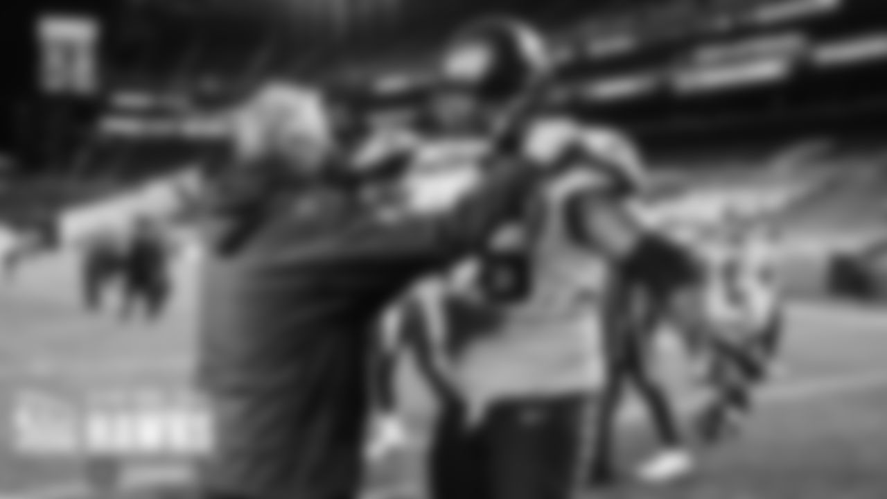 Seahawks left tackle Duane Brown embraces head coach Pete Carroll after the come-from-behind win.