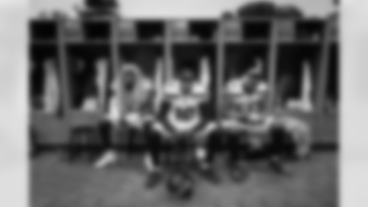 In the moments before leaving the locker room, Seahawks edge rushers Boye Mafe, Uchenna Nwosu and Dre'Mont Jones sit in front of their lockers.