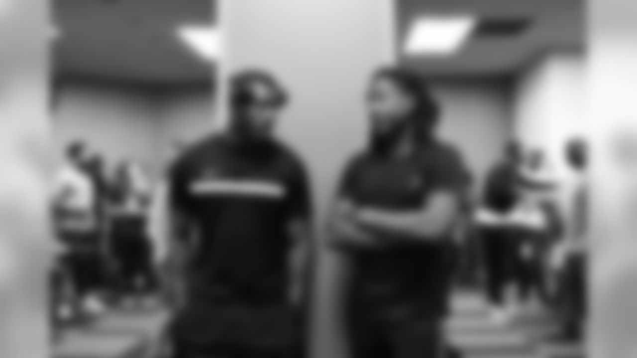 Defensive backs Mike Tyson and Shaquill Griffin chat before the start of walkthru.