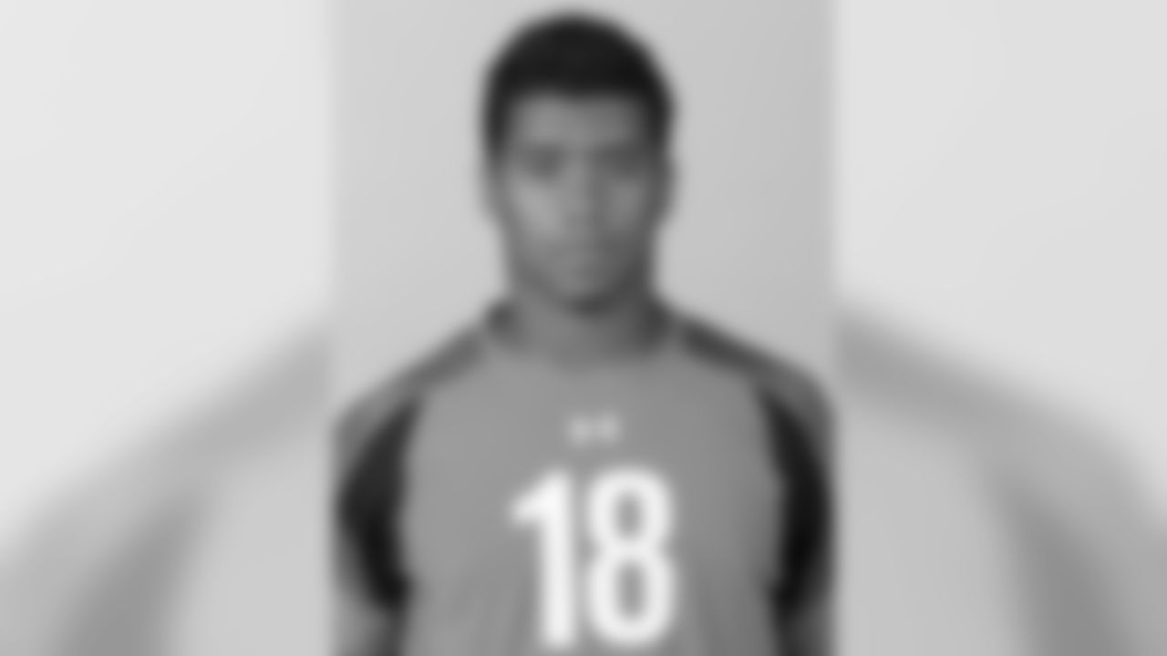 Wisconsin quarterback Russell Wilson poses for a headshot during the 2012 NFL Scouting Combine at Lucas Oil Stadium on Feb. 24 in Indianapolis, Ind. (AP Photo/Ben Liebenberg)