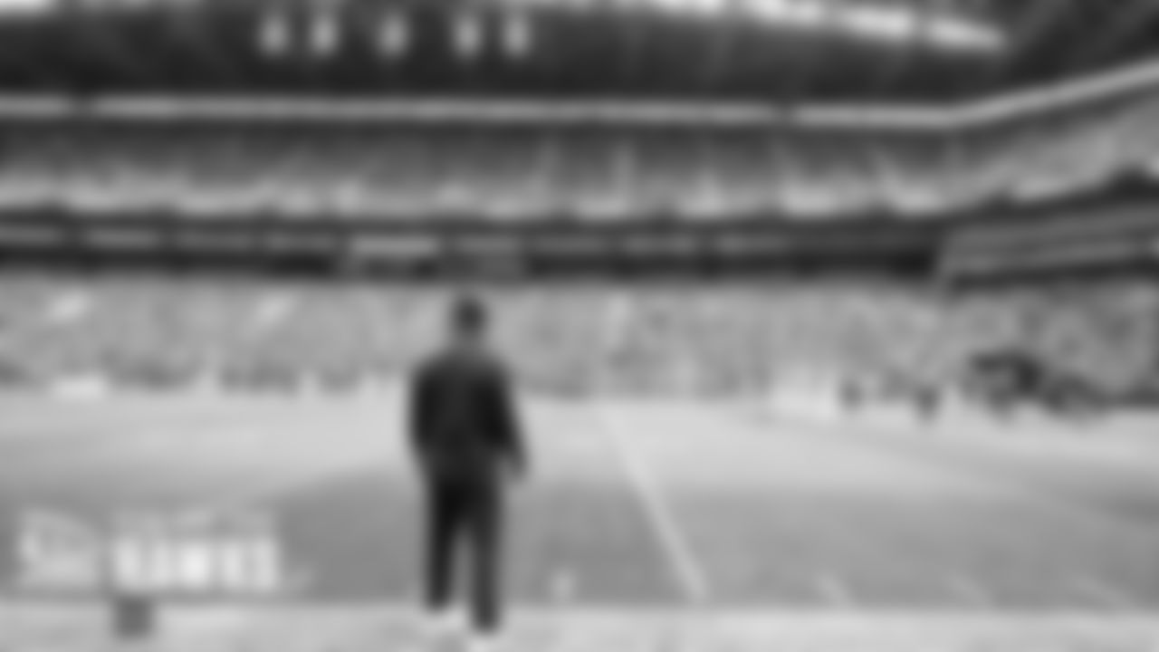 Seahawks defensive coordinator Ken Norton, Jr. calls plays just before halftime.