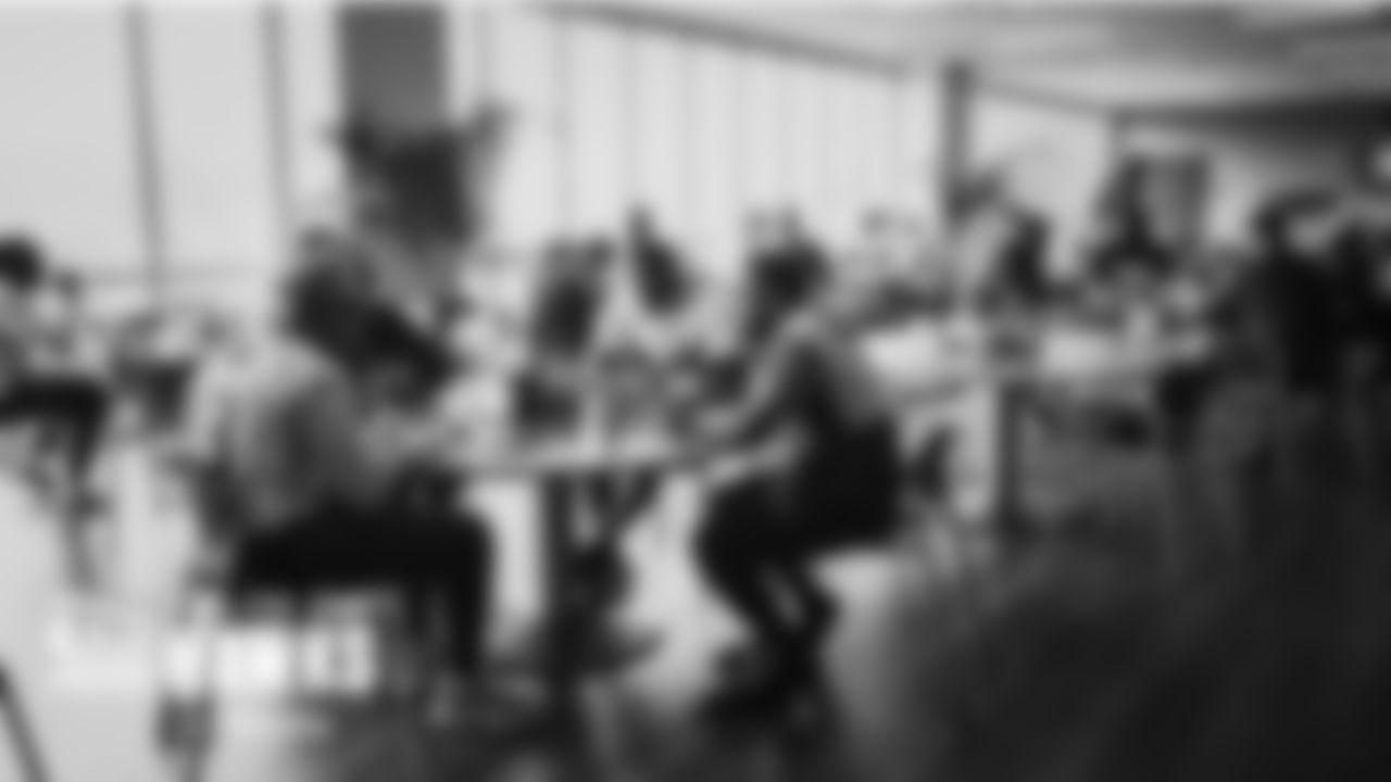 Seahawks players including Jamal Adams, Darrell Taylor, Quandre Diggs and Tre Brown share tables in the lunchroom.