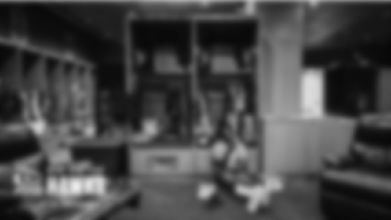Darrell Taylor relaxes at his locker during the team's lunch break.