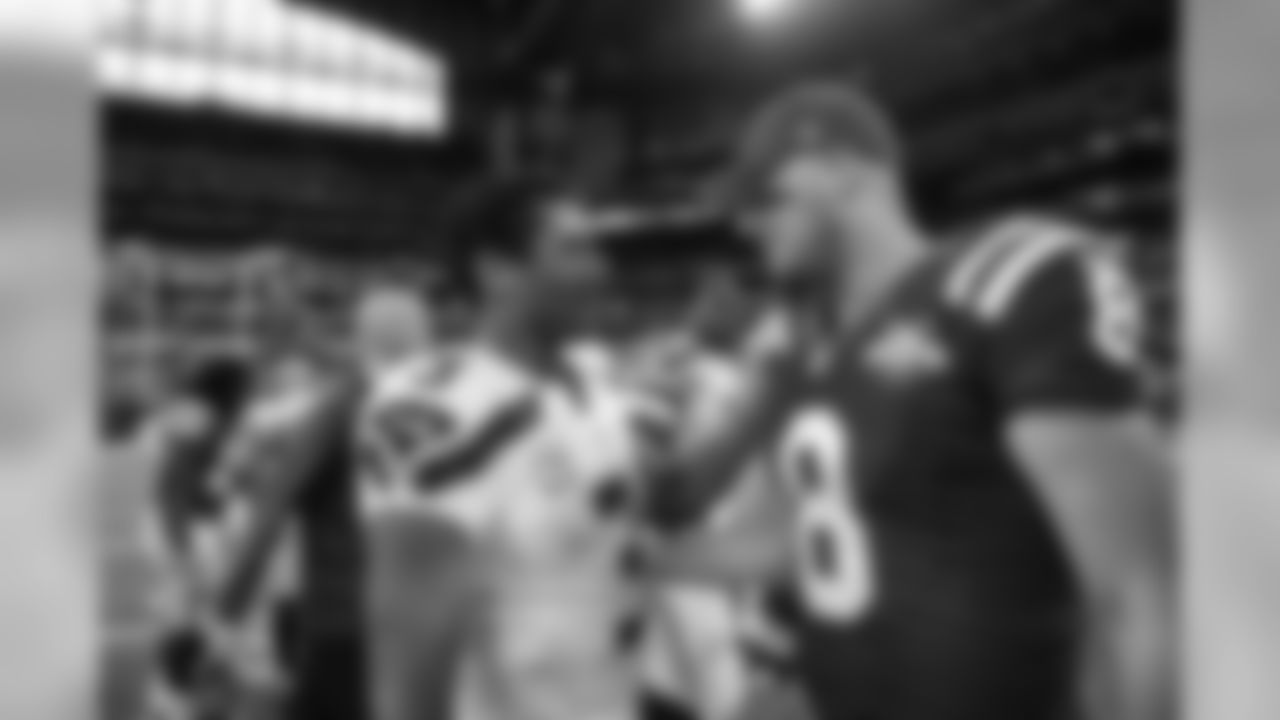 Two generations of Seahawks quarterbacks - Russell Wilson and Matt Hasselbeck chat after the game.