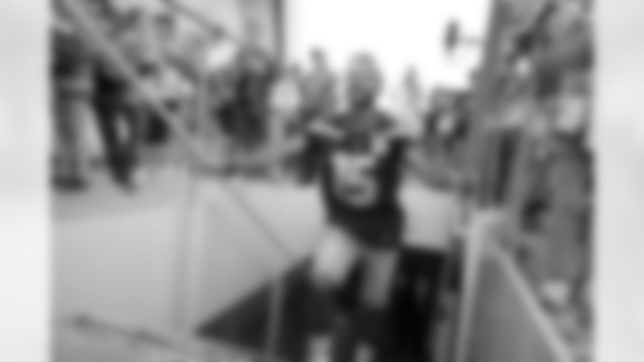 Seahawks legend Seneca Wallace raises the 12 Flag in advance of the preseason matchup vs. the Dallas Cowboys at Lumen Field on August 19, 2023.