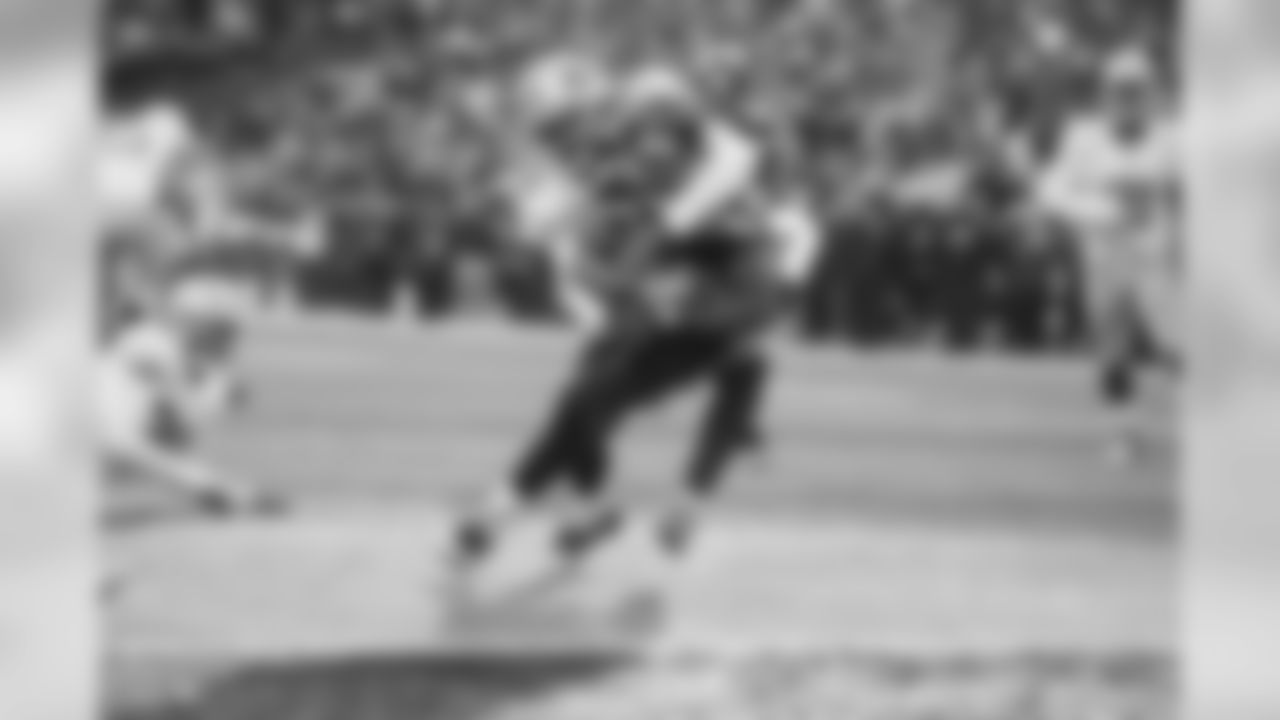Seahawks receiver Tyler Lockett drags San Francisco's Jaquiski Tartt the final few yards into the end zone on an 11-yard touchdown reception, giving Seattle a 20-0 lead in the second quarter.