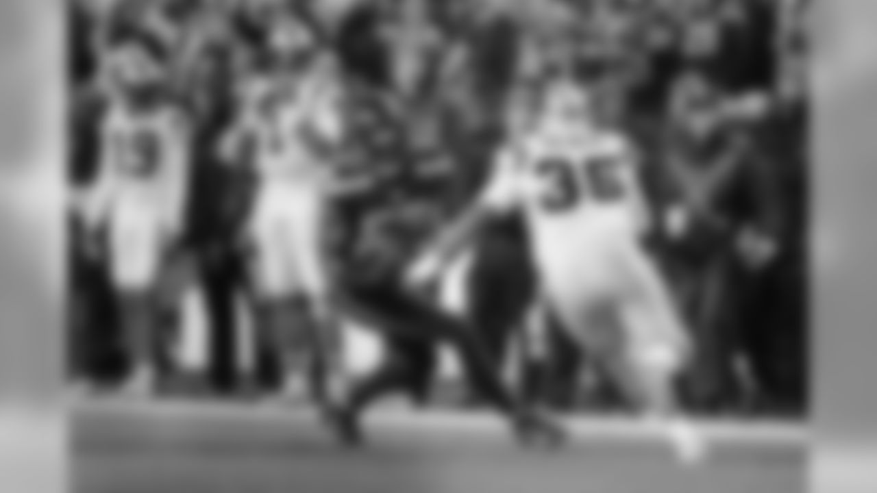 With Panthers quarterback Cam Newton (1) watching from the sideline, Seattle's Mike Morgan intercepts a pass that bounced off the hands of Carolina's Mike Tolbert during the opening drive of the game.