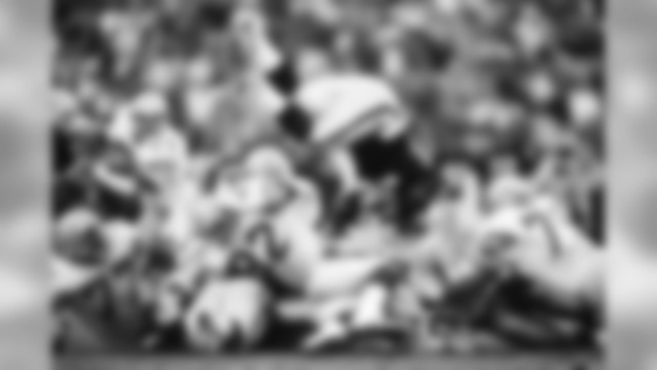 Seattle Seahawks defensive lineman Dave Wyman (92) flips Los Angeles Raiders running back Marcus Allen (32) in the air during the NFL football game against the Los Angeles Raiders on Dec. 18, 1988 in Los Angeles. The Seahawks won the game 43-37. (Paul Spinelli via AP)