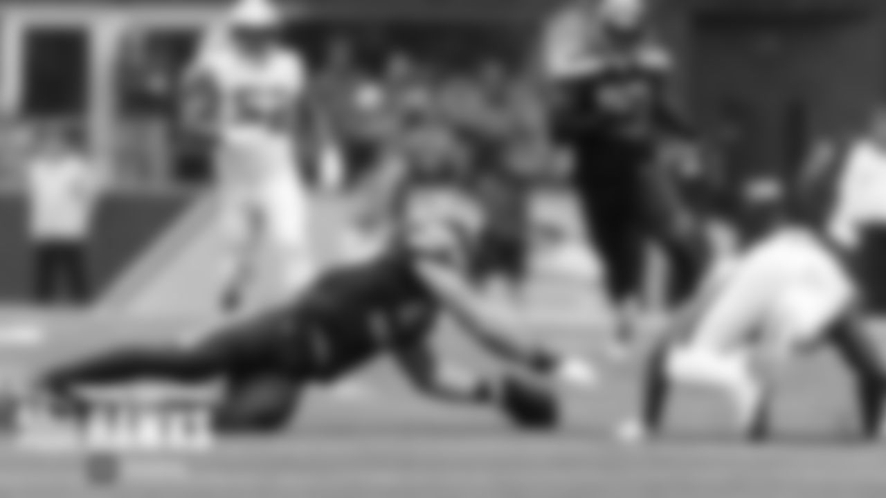 Seattle's Cody Barton falls on a fumble by Saints returner Deonte Harris in the second half.