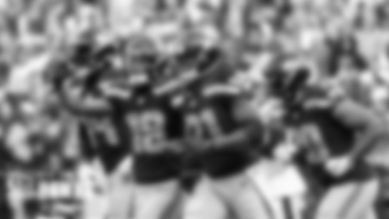 New Seahawks running back Adrian Peterson celebrates with teammates DK Metcalf, Freddie Swain and Rashaad Penny after scoring his first TD with Seattle.