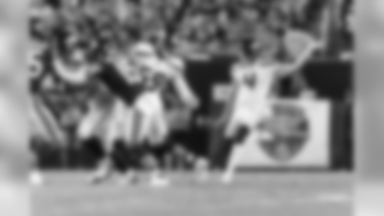 Punter Michael Dickson punts during the first half.